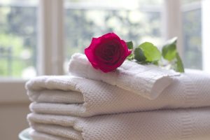 Stack of Towels with Rose in Spa