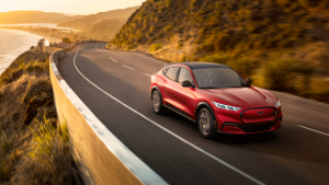 Red 2021 Mustang Mach-E Driving Down Highway