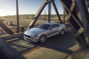 Silver 2021 Ford Mustang Driving on Bridge