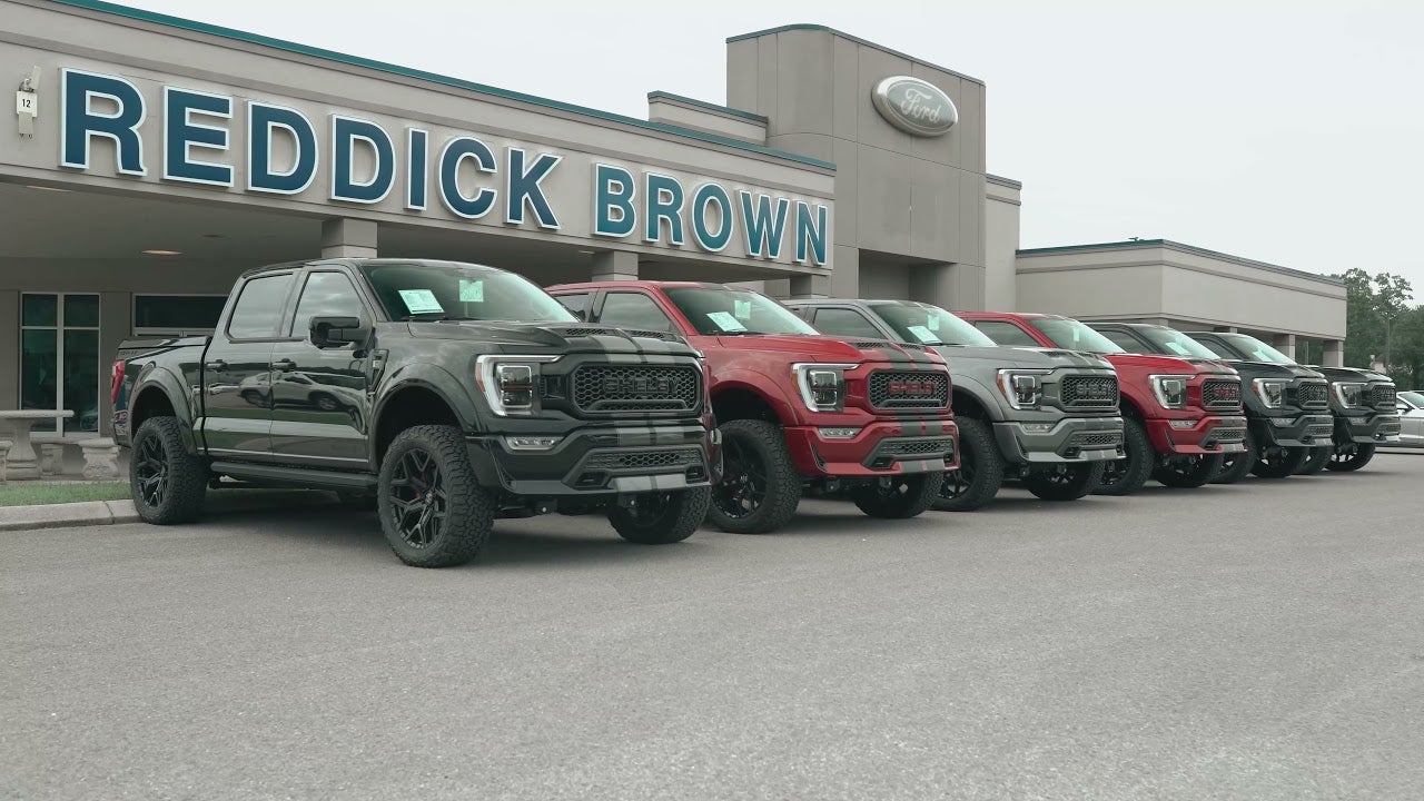 Line up of Ford F-150's in front of Reddick Brown Ford